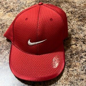 This is a Nike cap size 7 38 adjustee color, red and white